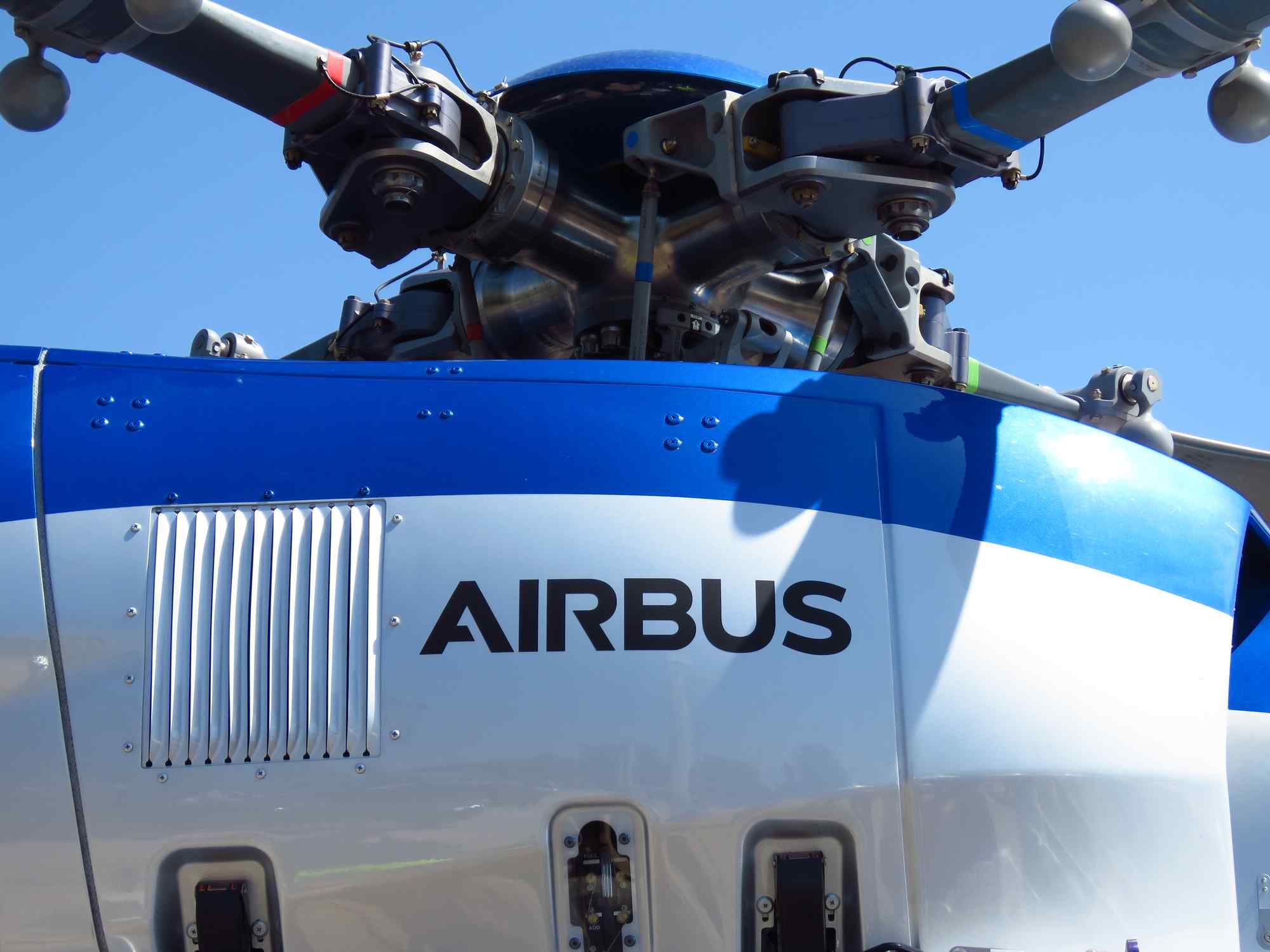 Airbus helicopter main rotor head assembly showing hub, pitch links, and blade grips - AATECH helicopter spare parts procurement Southeast Asia